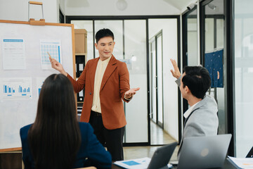 Sticker - Office colleagues have a casual discussion. During a meeting in a conference room, a group of business teem sit in office room new startup project.