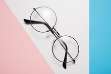 Eyeglasses With Round Rim For Men Or Women Lie Diagonally.