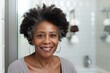 © Olena - Portrait of a gorgeous 50 year old middle aged African American woman standing in the bathroom after showering. Old skin care concept.