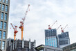 Building construction with tower crane in developing city