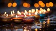 Diwali lights placed nearby Diya's in low light, bokeh background, copy space