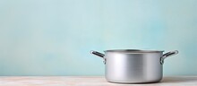 Vintage Silver Cooking Utensils On A Brightly Lit Surface Isolated Pastel Background Copy Space