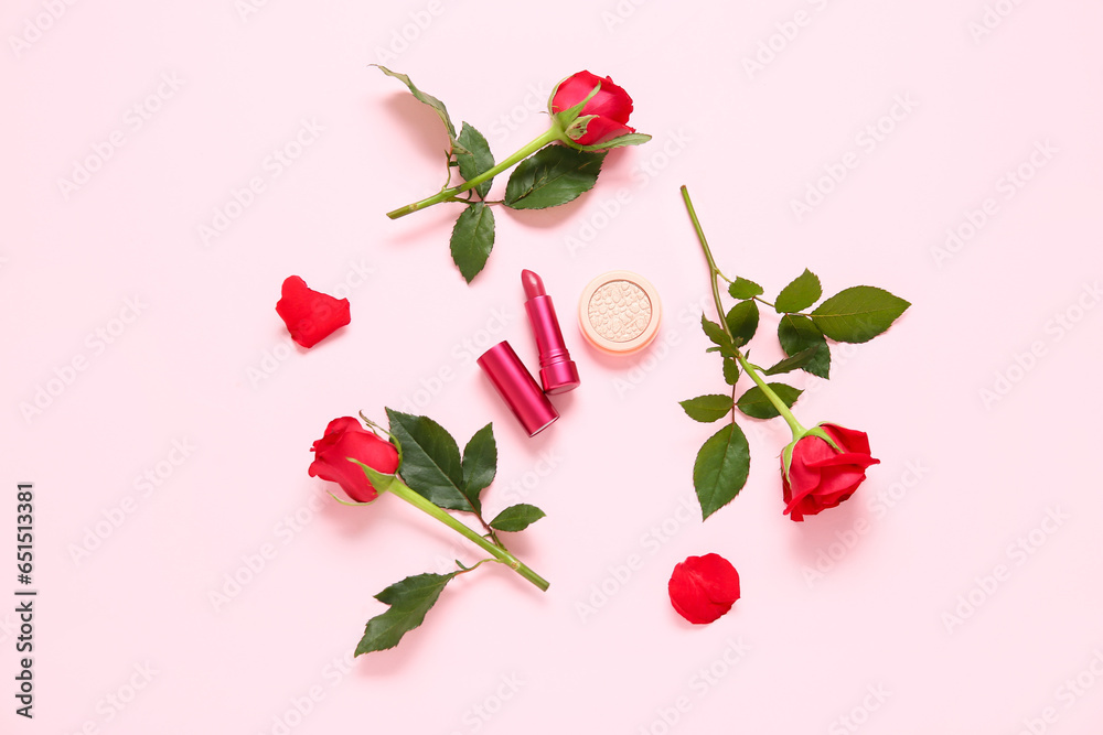 Composition with makeup products and beautiful red rose flowers on pink background