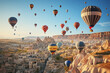 © PRASANNAPIX - Panoramic view with Colorful hot air balloons fly in sky