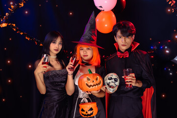 Asian Teenagers in Halloween Costumes Looking Camera, Invite For Enchanting Halloween Season Celebrations. Halloween Haunt Party of Asian Style, Fusion of Tradition and Frightful Delights.