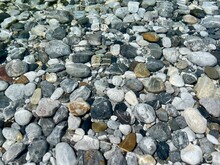 Aerial View Of Pebbles In Crystal Clear Shala River, Albania.