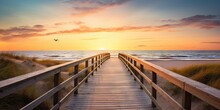 Serene Sunset Overlooking Calm Beach. Tranquil Beginnings. Peaceful Sunrise On Ocean Shore. Wooden Path To Paradise. Relaxing Beachside Boardwalk At Dawn