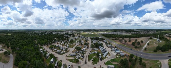 Village of tiny houses. Tiny home community with shared amenities. Usually sized between 100 and 400 square feet, energy-efficient tiny homes allow homeowners to create a secluded backyard destination