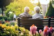 © id512 - senior couple elderly man and woman sitting on the bench in garden, healthy retirement