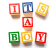 Children' blocks spelling out it's a boy. Birth or gender announcement