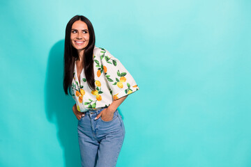 Sticker - Portrait of good mood nice girl with straight hairdo wear stylish shirt look at promo empty space isolated on teal color background