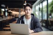 © CYBERUSS - Portrait of Cheerful Male Student Learning Online in Coffee Shop, Young Asian Man Studies with Laptop in Cafe, Doing Homework