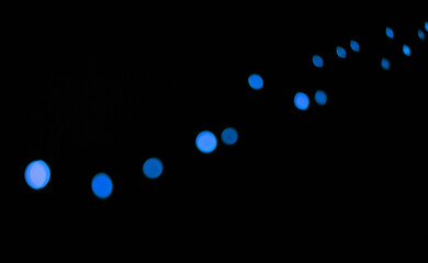 Wall Mural - bokeh, neon blue lights on black background and dots with pattern, texture and mockup with cosmic ae