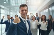© CYBERUSS - Confident Businessman Showing a Fighting Pose, Handsome Manager Gestures Raising Fists in Modern Office, Male Entrepreneur Fights a Problem