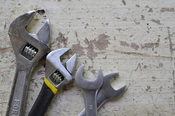 Set of professional construction tools and safety helmet on work table. Top view. Old tools. Various tools on a wooden table