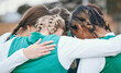 © Mumtaaz D/peopleimages.com - Hug, sports women or team in huddle with support, solidarity or plan for a hockey training game. Group, strategy or female athletes in practice for fitness exercise or match together for teamwork