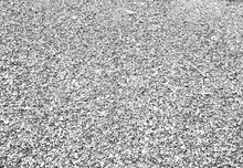 Background From Small Gravels, Top View. Gray Construction Gravel Texture For A Poster, Calendar, Post, Screensaver, Wallpaper, Postcard, Banner, Cover, Website. Toned High Quality Photo