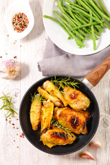 Wall Mural - fried chicken with rosemary- green bean-top view