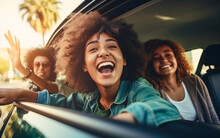 A Group Of Girls Friends Travel Together By Car, Laugh And Have Fun On Vacation