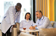 © Art_Photo - Group of professional medical doctor team meeting training medical in uniform working discussing and talk with patients record, teaching medic team, sit in hospital.health medical care concept