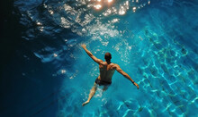 Top View Of Man Swimming In Pool. Background For Sport And Recreation On Holiday.