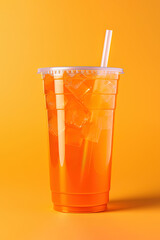 Wall Mural - Orange color drink in a plastic cup isolated on a orange color background. Take away drinks concept