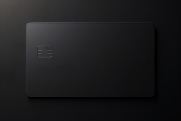 Poster - A black credit card sitting on top of a table. This image can be used to illustrate financial transactions, online shopping, or personal finance articles.