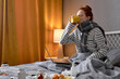 © alfa27 - redhead woman having cough, sneezing, feeling sick while working online from home, freelance during covid-19, coronavirus, omicron. female with headache drinking hot tea to lower the temperature