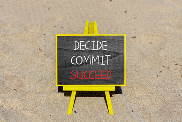 Wall Mural - Decide commit succeed symbol. Concept word Decide Commit Succeed on beautiful black chalk blackboard. Sand beach. Beautiful sand beach background. Business decide commit succeed concept. Copy space.