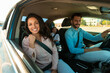 © Prostock-studio - Family vehicle. happy family driving car enjoying first ride together, woman sitting in front passenger's seat
