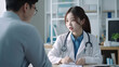 © JKLoma - An Asian female doctor is providing consultation to patients within a hospital or clinic