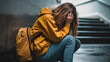 A depressed teenage girl sitting in school corridor and crying. Generative AI