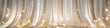 White curtain gold sparkles wide background