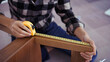 © snowing12 - Women measuring length of chair with measure tape while assembling and renovation chair furniture