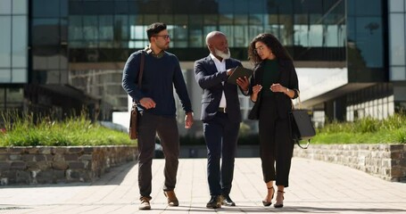 Poster - Walking, talking and business people with a tablet in the city for planning, meeting or discussion. Teamwork, corporate and employees speaking with technology for a strategy, internet or email