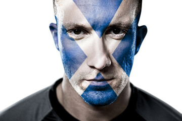 Poster - Digital png photo of caucasian man with flag of scotland on face on transparent background