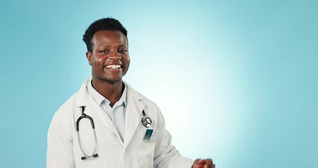 Canvas Print - Face, pointing and black man with promotion, doctor or announcement on a blue studio background. Portrait, African person or medical professional with a smile, opportunity or healthcare with decision