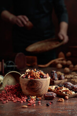 Poster - Various dried fruits and nuts on a kitchen table.