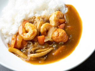 Poster - Shrimp and vegetable curry rice on a plate