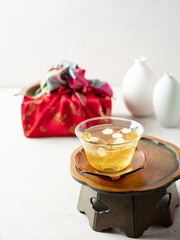 Canvas Print - Warm ginseng tea on a traditional table