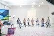 © daryakomarova - Unfocused bokeh effect positive concept against the background of unrecognizable people diverse business team meeting of young professionals corporate startup. High quality photo