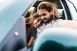 © Westend61 - Happy young couple in a car