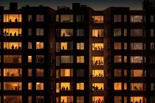 Apartments With Silhouettes Of People In The Windows At Night. ,Generative AI