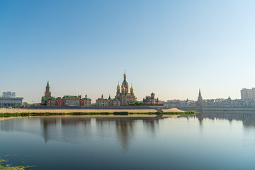 Wall Mural - Yoshkar-Ola, Russia. Cathedral of the Annunciation of the Blessed Virgin in Yoshkar-Ola. The river Malaya Kokshaga