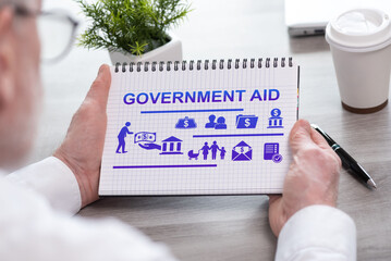 Sticker - Government aid concept on a notepad