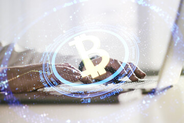Poster - Double exposure of creative Bitcoin symbol hologram with hands typing on computer keyboard on background. Mining and blockchain concept