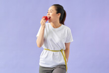 Healthy Female Body With Apple And Measuring Tape
