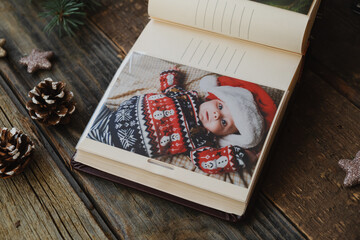 Wall Mural - Christmas printed photos in picture album. Photo printing concept. 