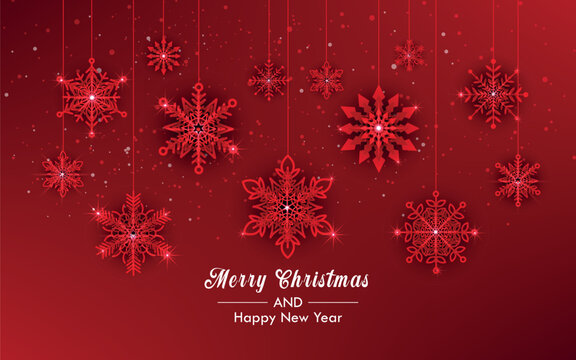 Christmas background with hanging snowflakes on red background