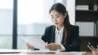 © AspctStyle - Portrait of Professional Asian female lawyer sit at her office desk